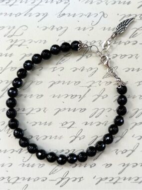 Sterling Silver Black Onyx Faceted Bead Bracelet with Wing Charm